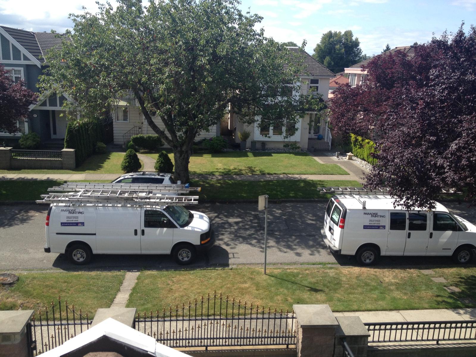 Paradise Painting vans at work in a leafy Lower Mainland neighbourhood.